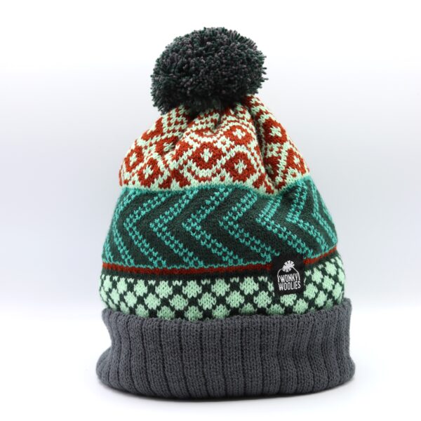 Wonky hat pictured, knitted pompom hat with three pattern areas.